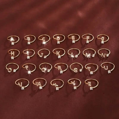 Adjustable Copper Initial Ring with Four-Claw Round Zirconia