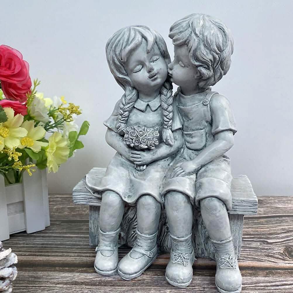 Boy Kissing Girl Statue Sitting on Bench Figurine