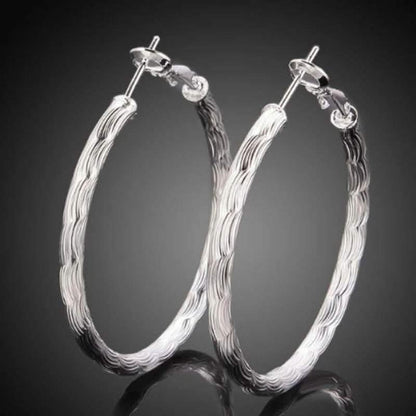 Diamond Cut Hoop Earrings In White Gold