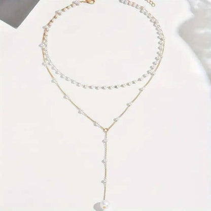 Elegant Vintage Style Double-Layer Pendant Necklace with Imitation Pearl Accents and Tassel Drop