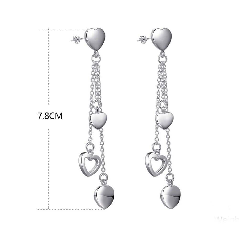Long Dangling Heart Earrings in White Gold
